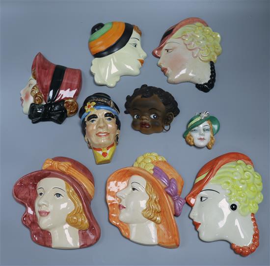 A group of nine ceramic wall masks